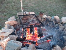 We cook great steaks over the campfire at hunting camp..